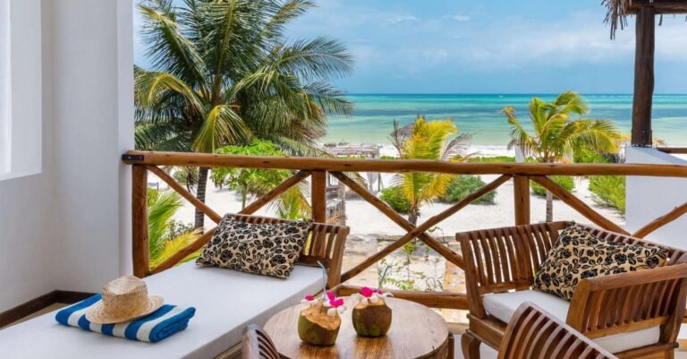 Next Paradise Boutique Resort beachfront view with white sand and turquoise Indian Ocean