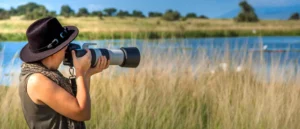 Photographer capturing wildlife during photography safari Tanzania tailor made experience